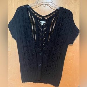 Black crocheted short sleeved cardigan.